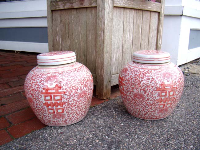 A pair of Chinese salmon colored "Double Happiness" ginger jars